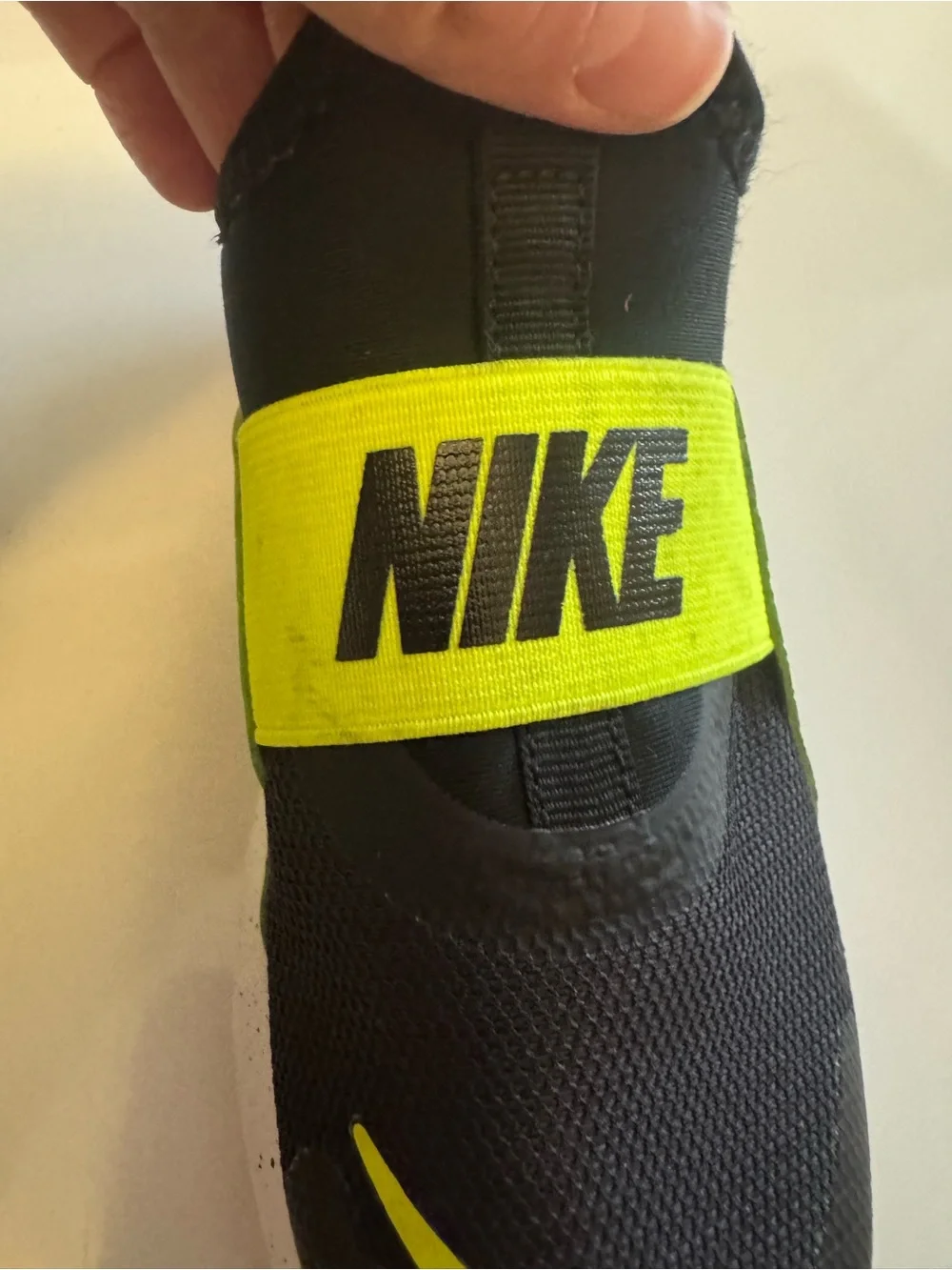 Nike Kids Slip-On Sneakers in Black and Volt